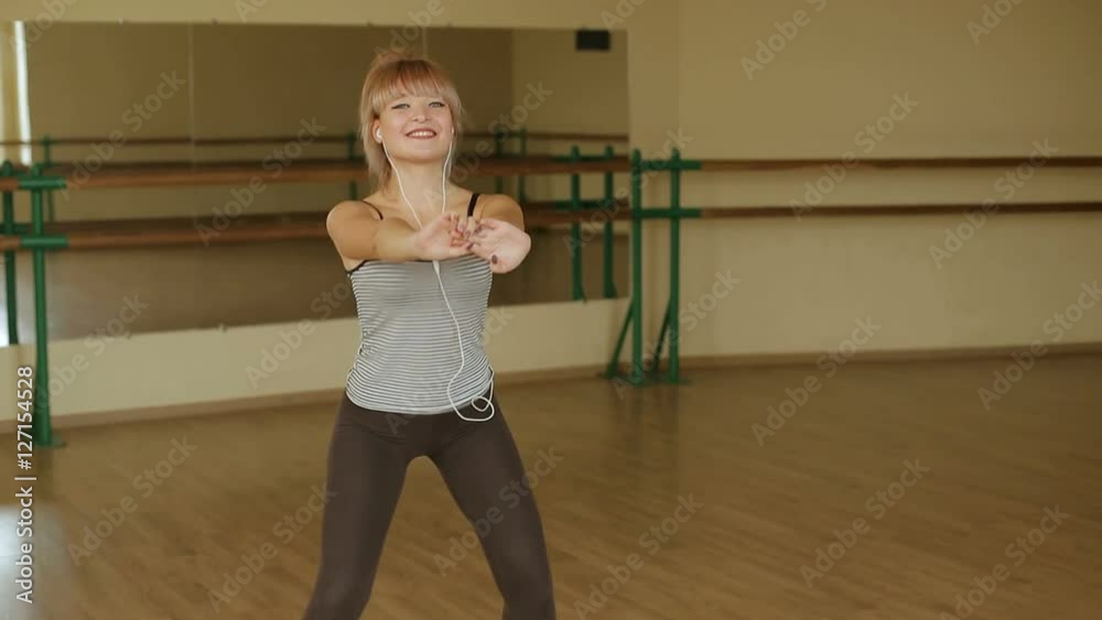 Young woman exercising, doing crouches on mat. Sport. Fitness. Young woman exercising, doing crouches on mat. Sport. Fitness.