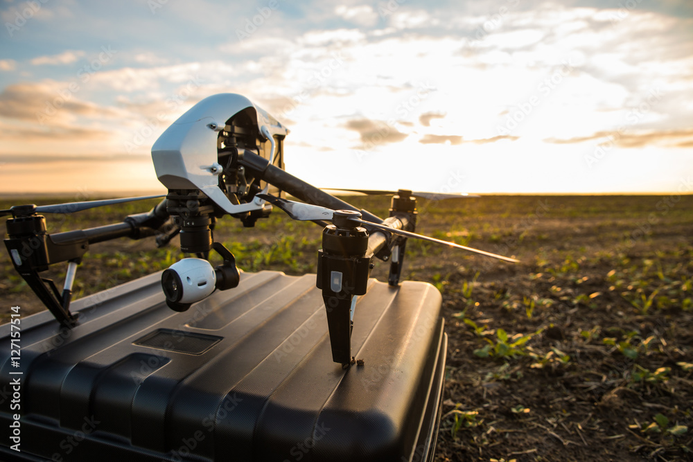 Copter over box in field over sky background Stock Photo | Adobe Stock