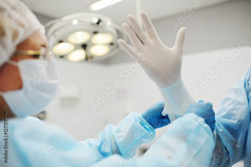 surgeon's gloved hands closeup
