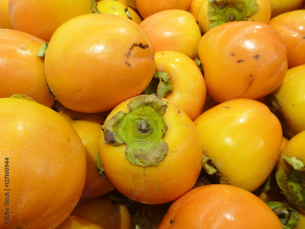 orange ripe kaki fruit in the market orange ripe kaki fruit in the market