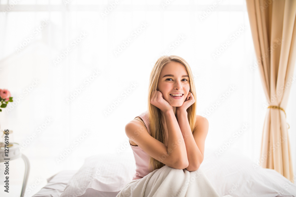 Young beautiful girl in morning bed with good mood Young beautiful girl in morning bed with good mood