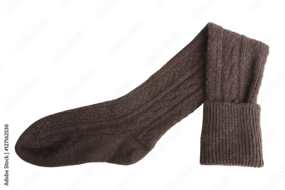 Brown Knitted sock on a white background isolated Brown Knitted sock on a white background isolated