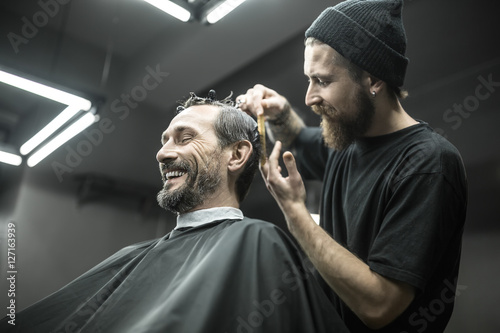 Cutting hair in barbershop