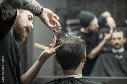 Cutting hair in barbershop