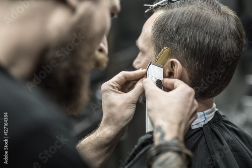 Doing haircut in barbershop