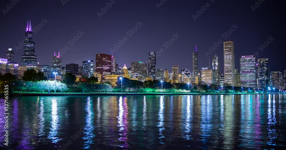 Chicago, Illinois, USA - view from the Lakefront Trail at the Field Museum / Shedd Aquarium facing north at shore of Lake Michigan and the skyline at night - Timelapse without motion Chicago, Illinois, USA - view from the Lakefront Trail at the Field Museum / Shedd Aquarium facing north at shore of Lake Michigan and the skyline at night - Timelapse without motion