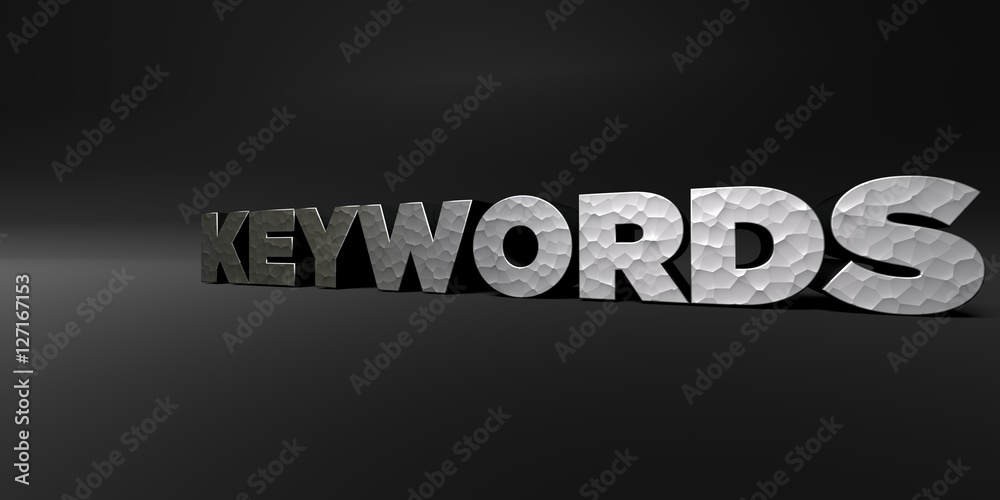 KEYWORDS - hammered metal finish text on black studio - 3D rendered royalty free stock photo. This image can be used for an online website banner ad or a print postcard.