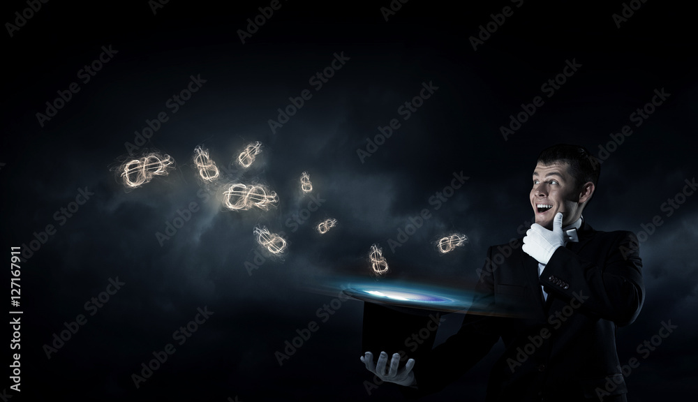Businessman demonstrating magic . Mixed media Businessman demonstrating magic . Mixed media