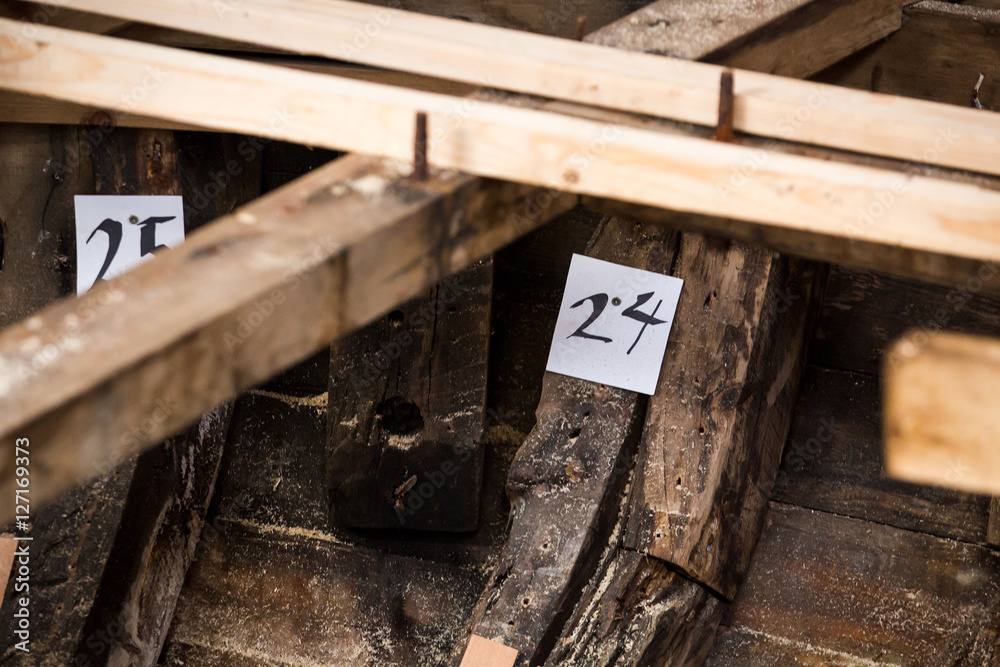 repairing old wooden fishing boat. Large ocean boat. Traditional Scandinavian wooden ships. ship repair workshop. repairing old wooden fishing boat. Large ocean boat. Traditional Scandinavian wooden ships. ship repair workshop.