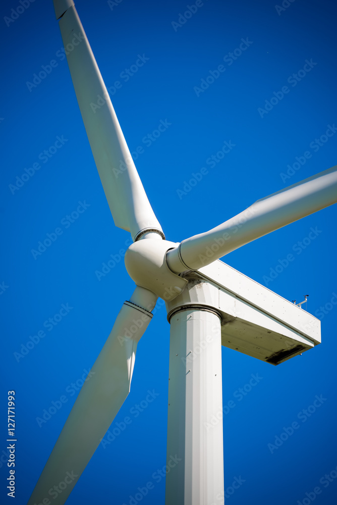 Wind generator, on a background of blue sky. Wind generator, on a background of blue sky.