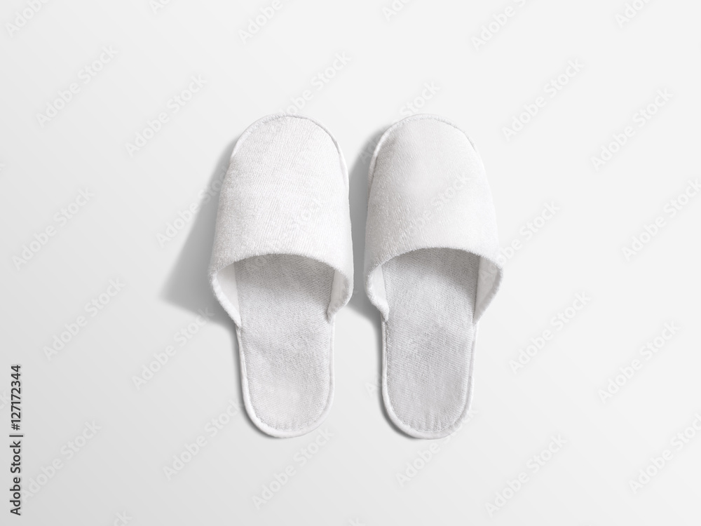 Foto Stock Pair of blank soft white home slippers, design mockup. House  plain flops mock up template top view. Clear warm domestic sandal. Bed  shoes accessory footwear. | Adobe Stock