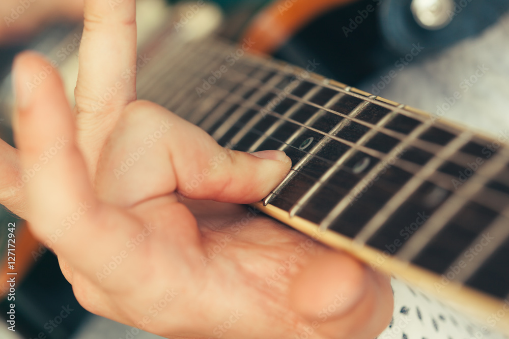 Fototapeta premium man playing electric guitar