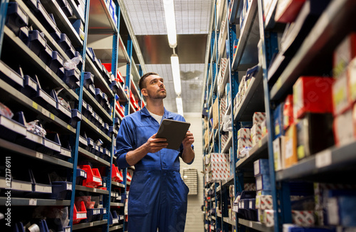 Принти на полотні auto mechanic or smith with tablet pc at workshop