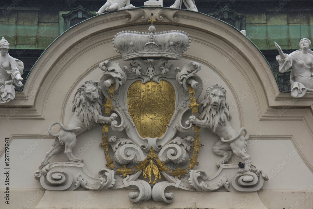 Architectural close up of the facade od Schloss Belvedere in Vienna, with its coat of arms with lions