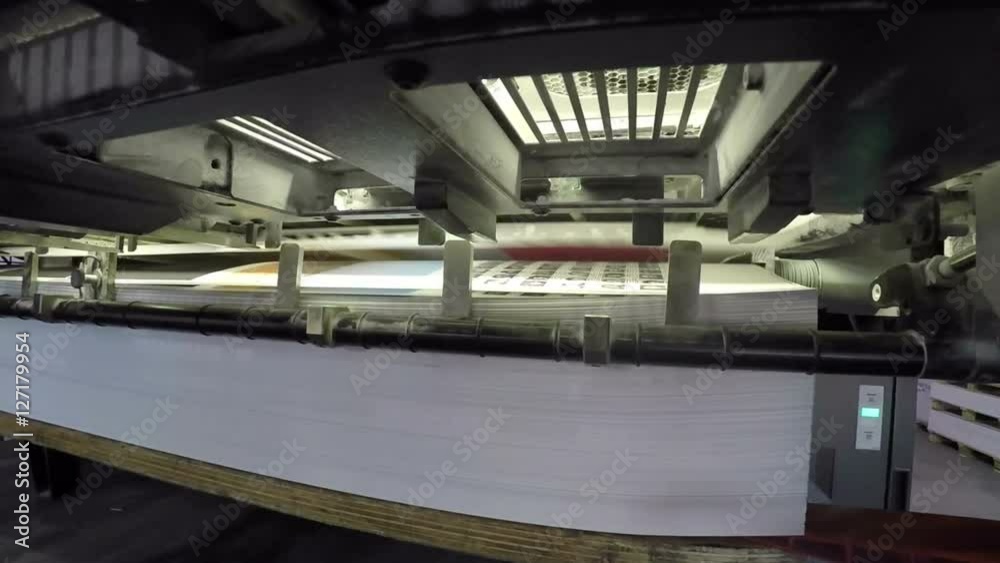 zooming in on a sheetfed offset printing mashine at work zooming in on a sheetfed offset printing mashine at work