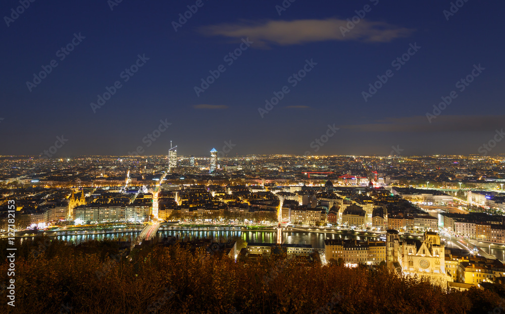 The illuminated city of Lyon, France,  seen from Fourviere hill at night.