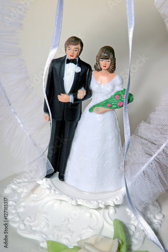 Weddingcouple on weddingcake. Marriage. Party.  photo