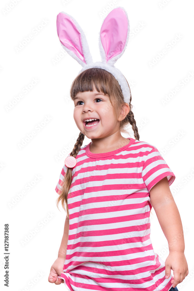Happy little girl with pink rabbit ears. Portrait of cute caucasian baby wearing bunny ears. Funny preschool child, isolated on white background. Healthy carefree kid - Easter holidays concepts. Happy little girl with pink rabbit ears. Portrait of cute caucasian baby wearing bunny ears. Funny preschool child, isolated on white background. Healthy carefree kid - Easter holidays concepts.