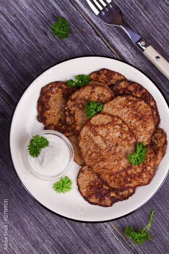 Liver Patties with Sour Cream and Parsley. Liver Cakes or Fritters of Liver. Healthy snack or take-away lunch bites