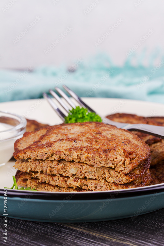 Liver Patties with Sour Cream and Parsley. Liver Cakes or Fritters of Liver. Healthy snack or take-away lunch bites Liver Patties with Sour Cream and Parsley. Liver Cakes or Fritters of Liver. Healthy snack or take-away lunch bites
