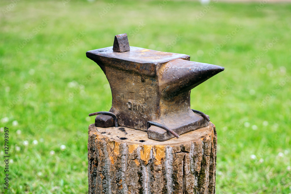 The old anvil is on the stump.