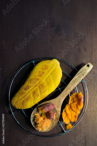 Overhead view of Yam bread leave shape on a wooden background, Thai traditional sweet