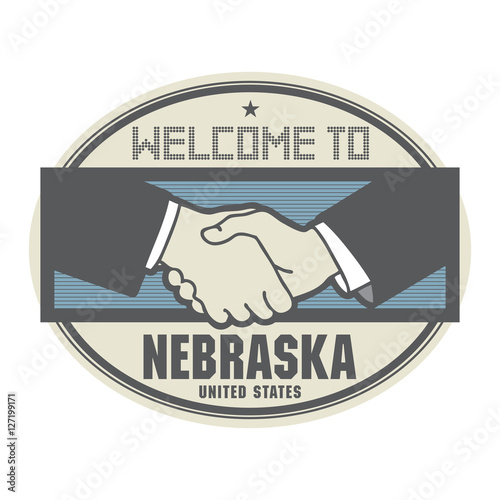 Business concept with handshake and the text Welcome to Nebraska