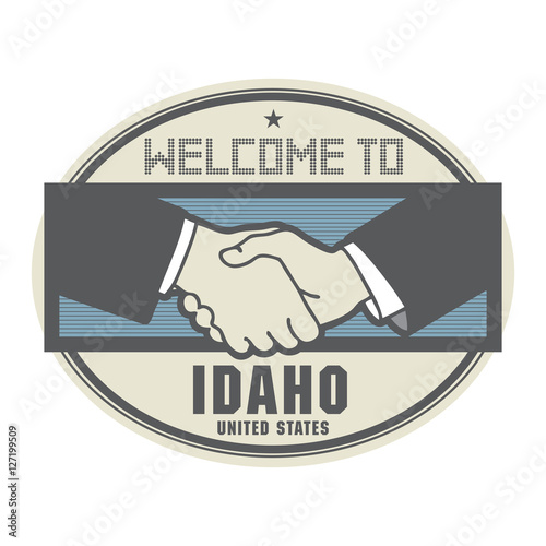 Business concept with handshake and the text Welcome to Idaho, 