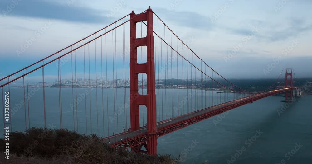 San Francisco, California, USA - Golden Gate Bridge and San Francisco Bay from famous Battery Spencer lookout at sunset from day to night - Timelapse with pan left to right San Francisco, California, USA - Golden Gate Bridge and San Francisco Bay from famous Battery Spencer lookout at sunset from day to night - Timelapse with pan left to right