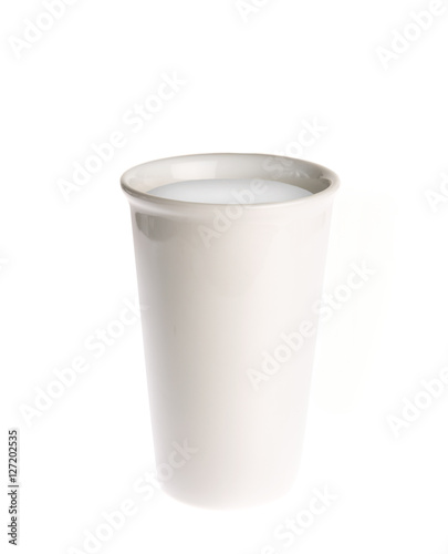 Glass filled with milk isolated on white