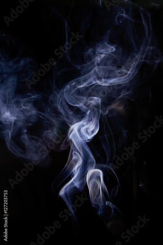 White smoke movement on black background.