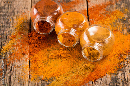 Spice. Various Spices over Wooden Background. paprika, turmeric, curry