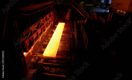 Fotografie Sheet of hot metal on the conveyor belt