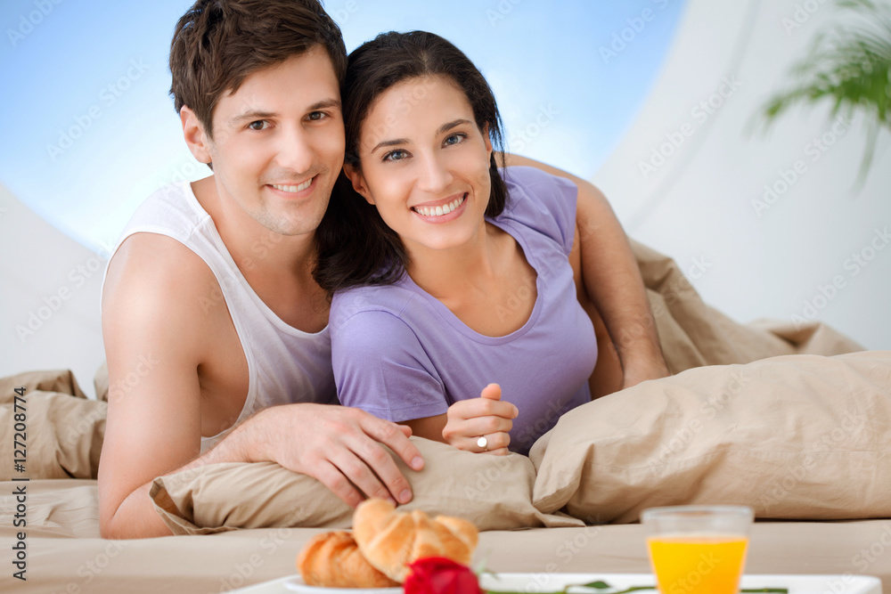 Cute Couple Having Breakfast in Bed