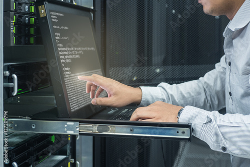 system administrator working in data center photo