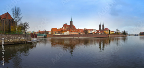 55 mpx Panoramic view of famous old island Tumski with cathedral of St. John reflection in the Odra river at dusk. Wroclaw, Poland, EU.