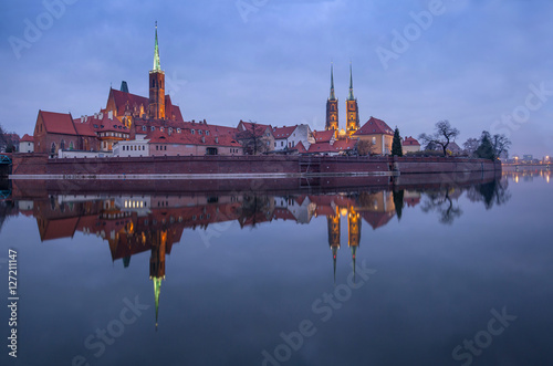 Panoramic view of famous old island Tumski with cathedral of St. John reflection in the Odra river. Wroclaw, Poland, EU. A long time shutter exposure.