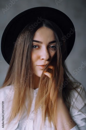 Portrait of young woman in the hat 