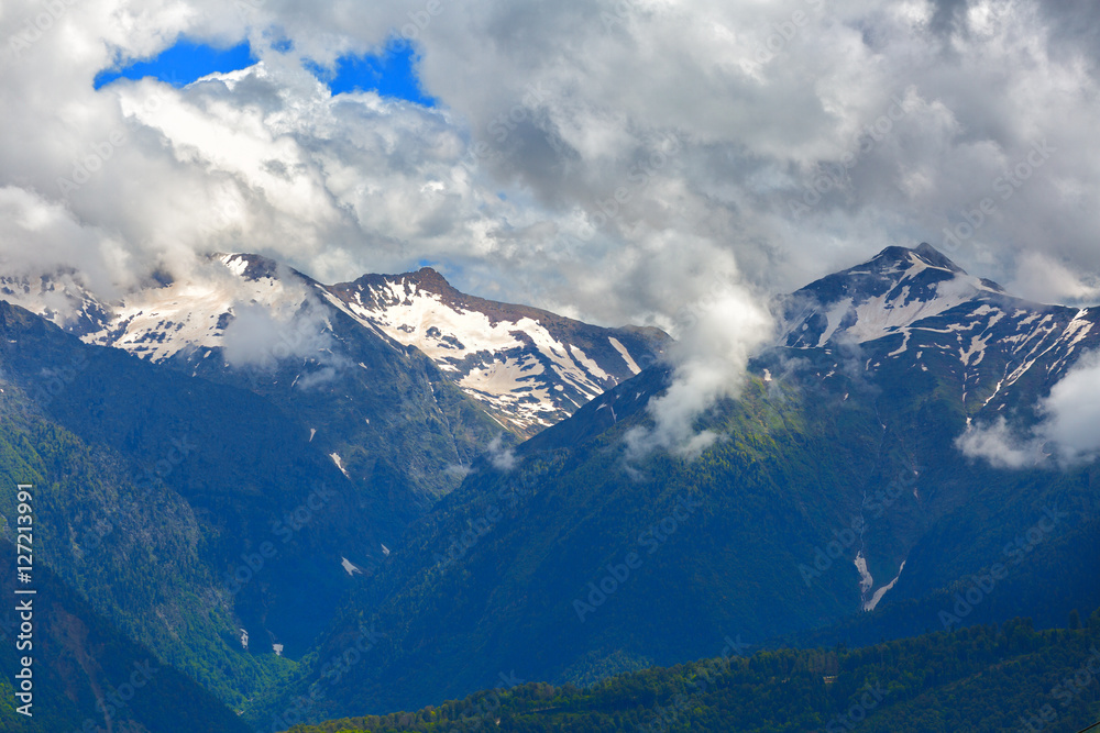 Mountain landscape with large white clouds Mountain landscape with large white clouds