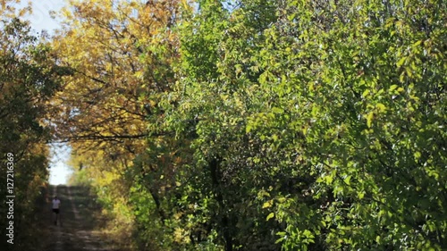 Runner in Autumn Forest
