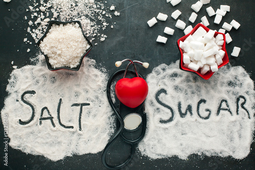 Sugar and salt brings harm to the heart, concept of healthy lifestyle without sugar and salt. photo