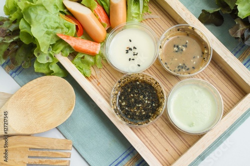 Salalroll and salad dressing photo