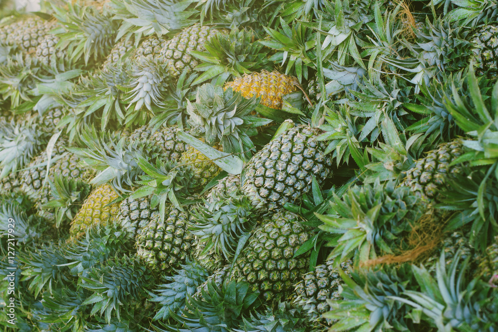 Pineapple background. Pineapples in the market.close up pineapple in market place for background. Pineapple background. Pineapples in the market.close up pineapple in market place for background.