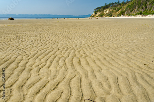 Fototapeta Naklejka Na Ścianę i Meble -  Waves of the sand on the beach in Vancouver, Canada.