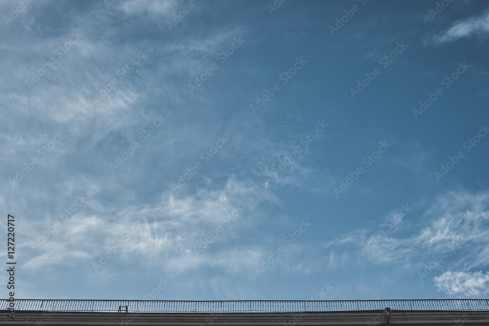 The sky above the roofs of the city in the clouds