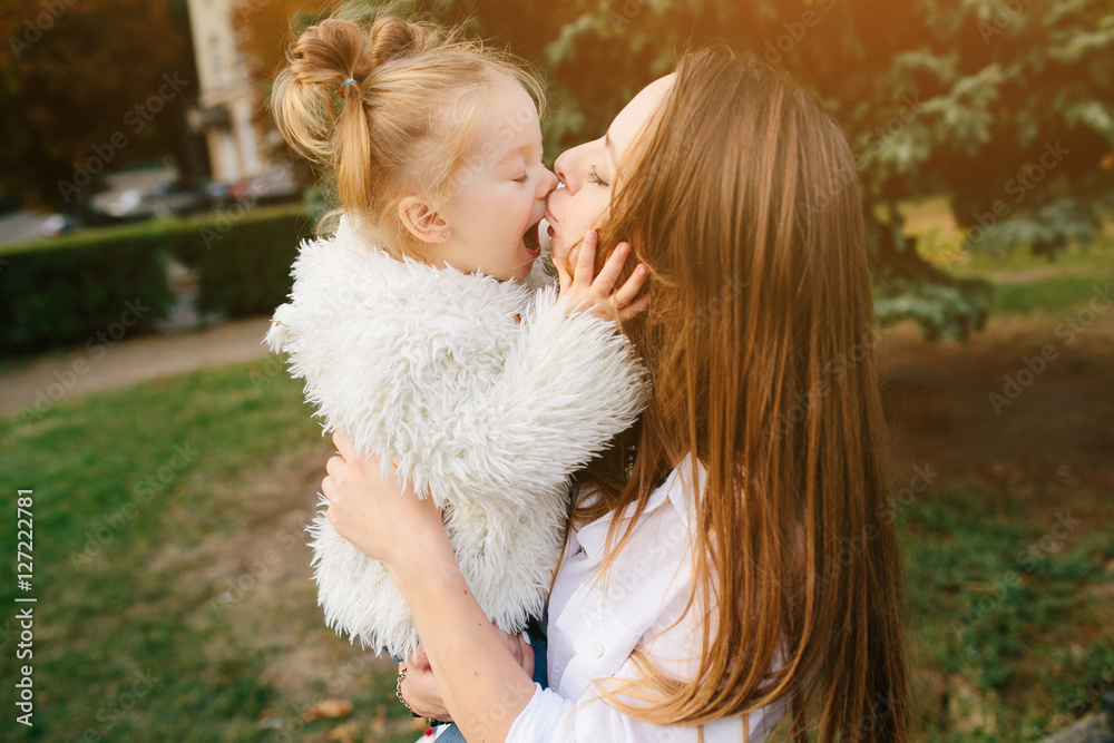 Mother and little daughter in a park Mother and little daughter in a park