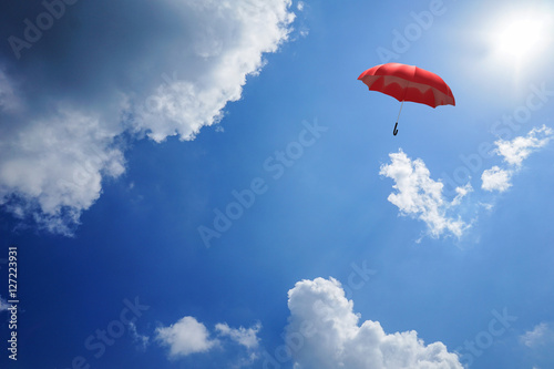 3D Rendering : illustration of Red umbrella floating above against blue sky and clouds. Business, leader concept, being different concepts;1st position