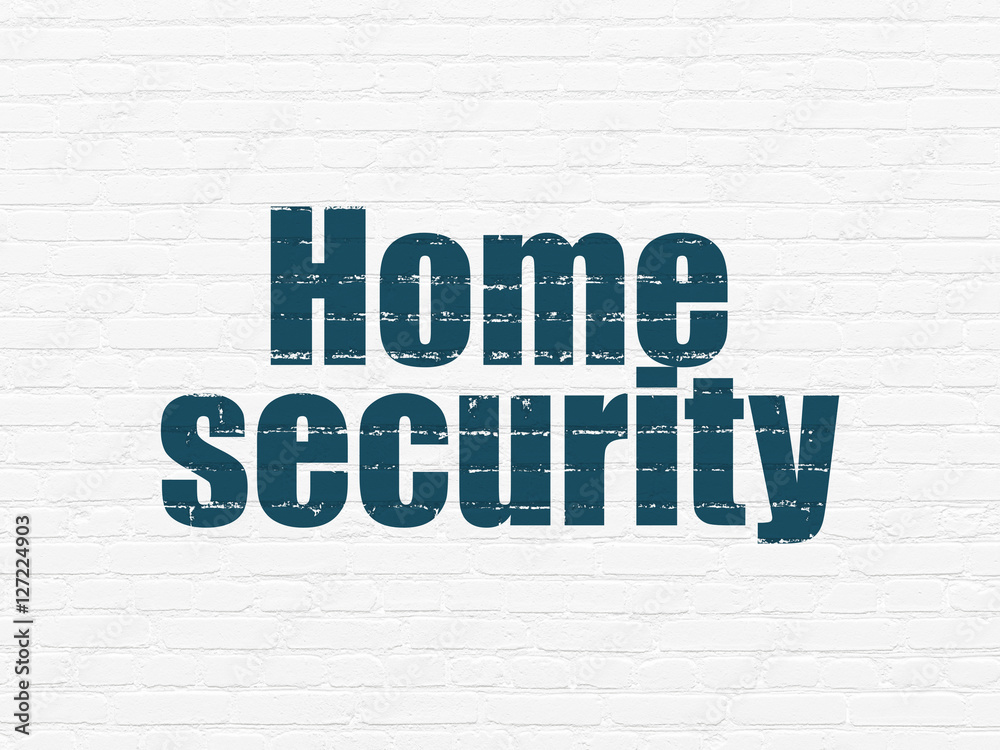 Protection concept: Home Security on wall background