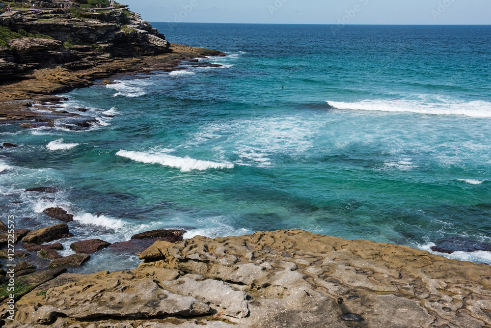 Bondi to Coogee coastal walk, Sydney, Australia. A cliff top coastal walk extends for 6 km in Sydney's eastern suburbs. The walk features stunning views, beaches, parks, cliffs, bays and rock pools Bondi to Coogee coastal walk, Sydney, Australia. A cliff top coastal walk extends for 6 km in Sydney's eastern suburbs. The walk features stunning views, beaches, parks, cliffs, bays and rock pools