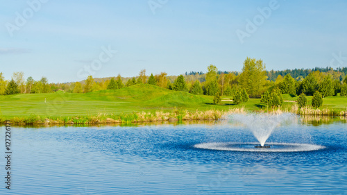Beautiful golf place with gorgeous green and pond
